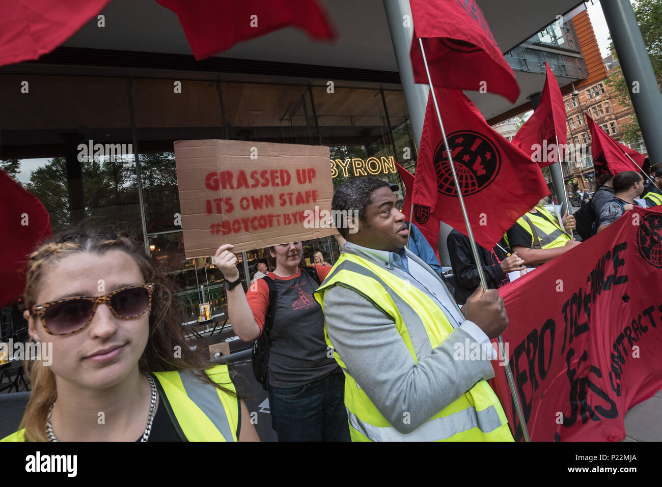 1 St Giles High Street, Holborn, London, July 29th 2016. A small group of protesters stage a demonstration outside a branch of Byron Burgers near to S Stock Photo