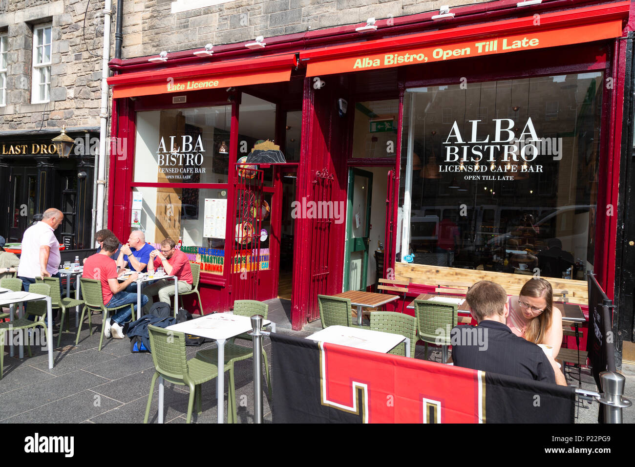 People eating and drinking at the Alba Bistro cafe, Grassmarket edinburgh Scotland UK Stock Photo