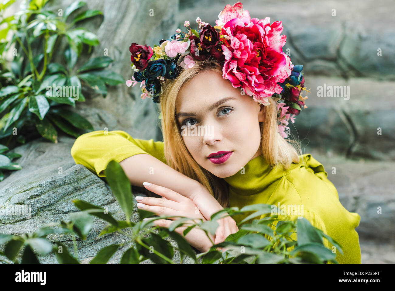Woman leaning on rocks hi-res stock photography and images - Alamy