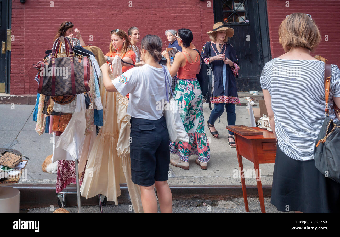 Shoppers search for bargains at the Jane Street Block Association Flea Market in the New York neighborhood of Greenwich Village on Saturday, June 2, 2018. The residents of Jane Street cleaned out their closets for their flea market.  (Â© Richard B. Levine) Stock Photo