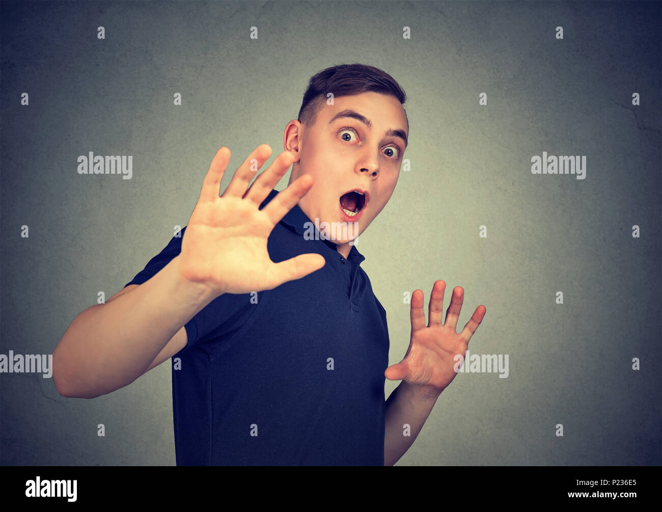 Young scared man with shocked facial expression Stock Photo