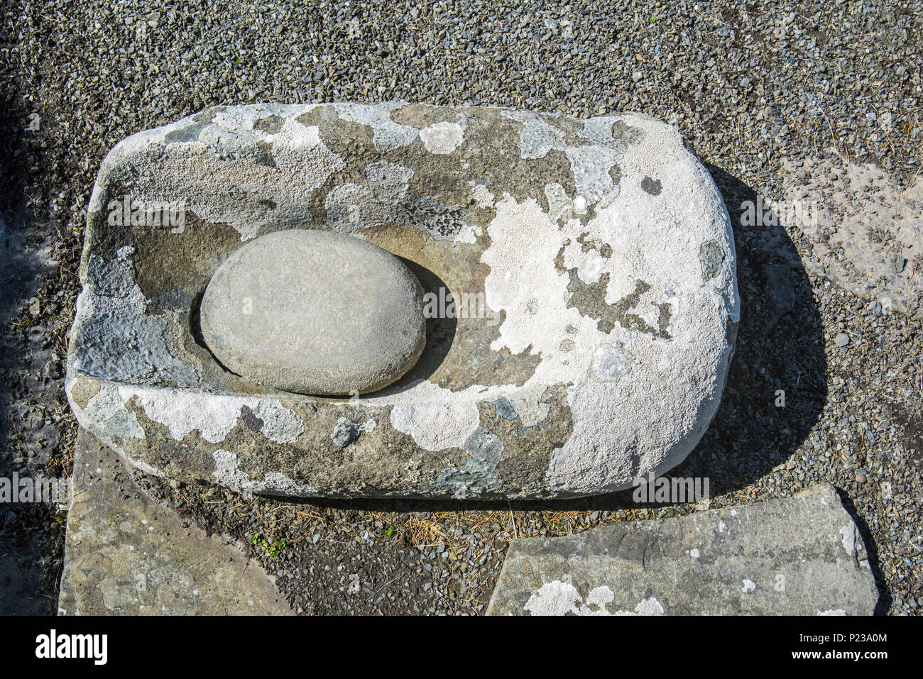 Stone quern at Jarlshof, archaeological site showing 2500 BC prehistoric and Norse settlements at Sumburgh Head, Shetland Islands, Scotland, UK Stock Photo