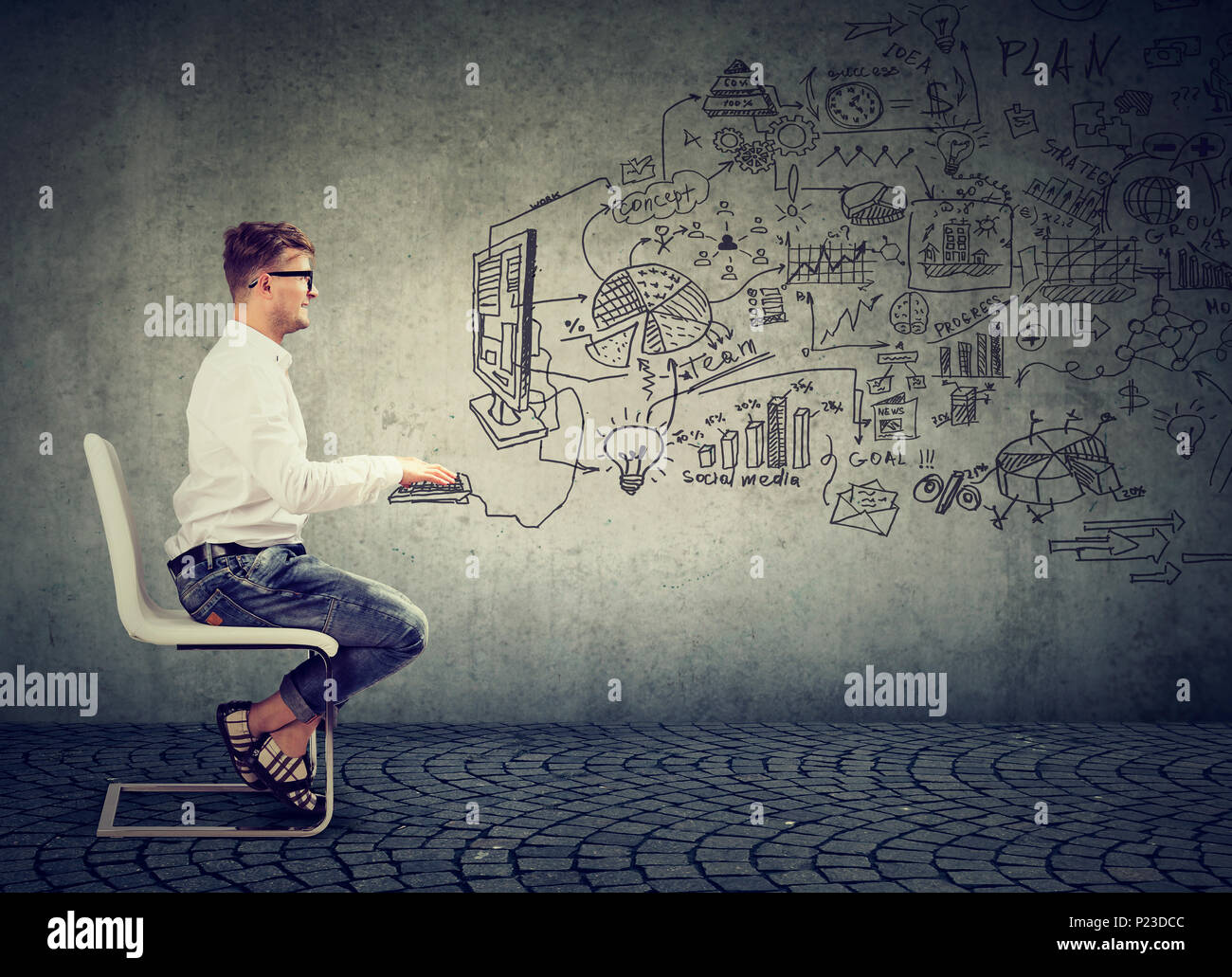 Casual man sitting on chair and working in online social media business with imagery of computer. Stock Photo