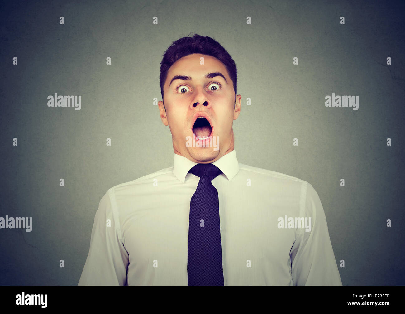 Portrait of a shocked scared young man Stock Photo