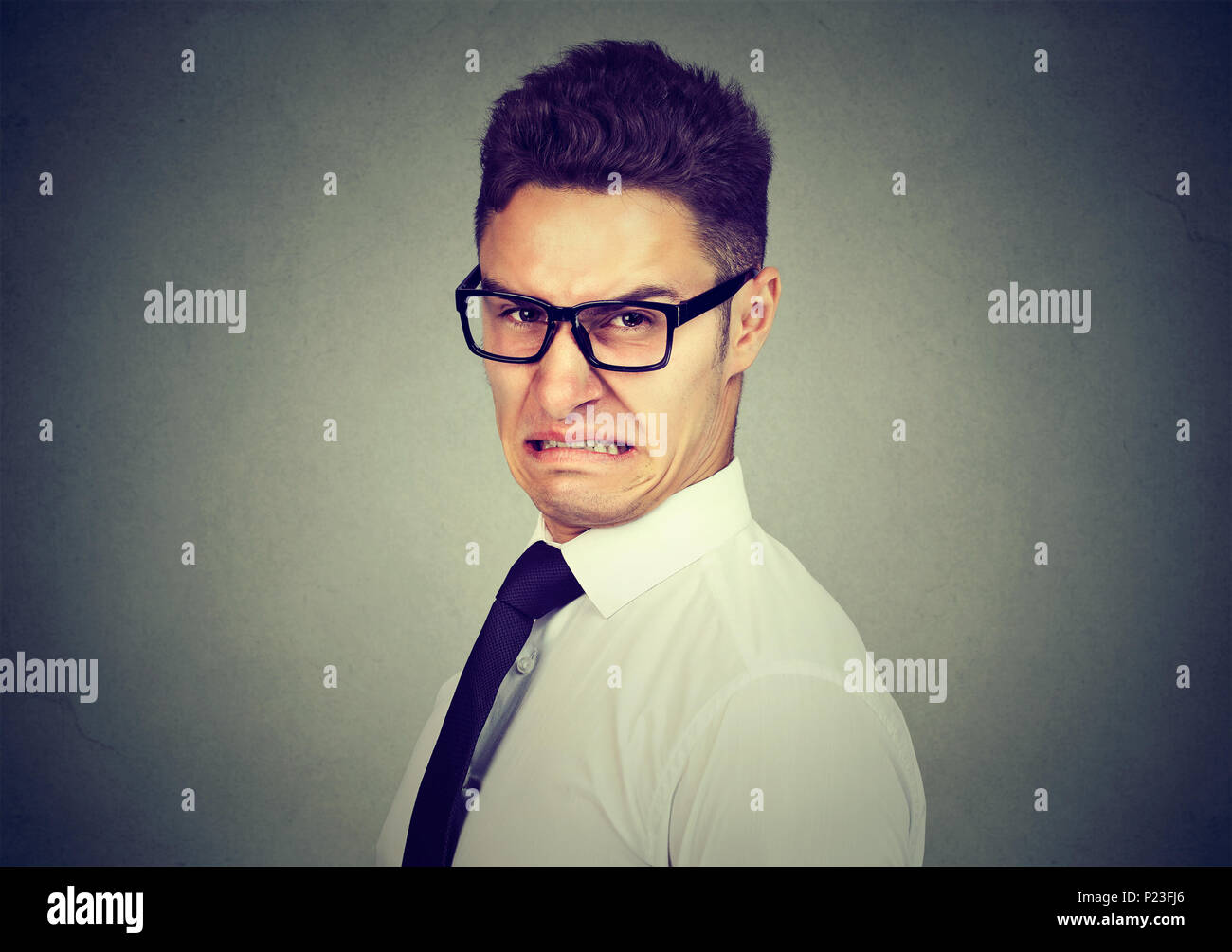Portrait of a disgusted young business man Stock Photo