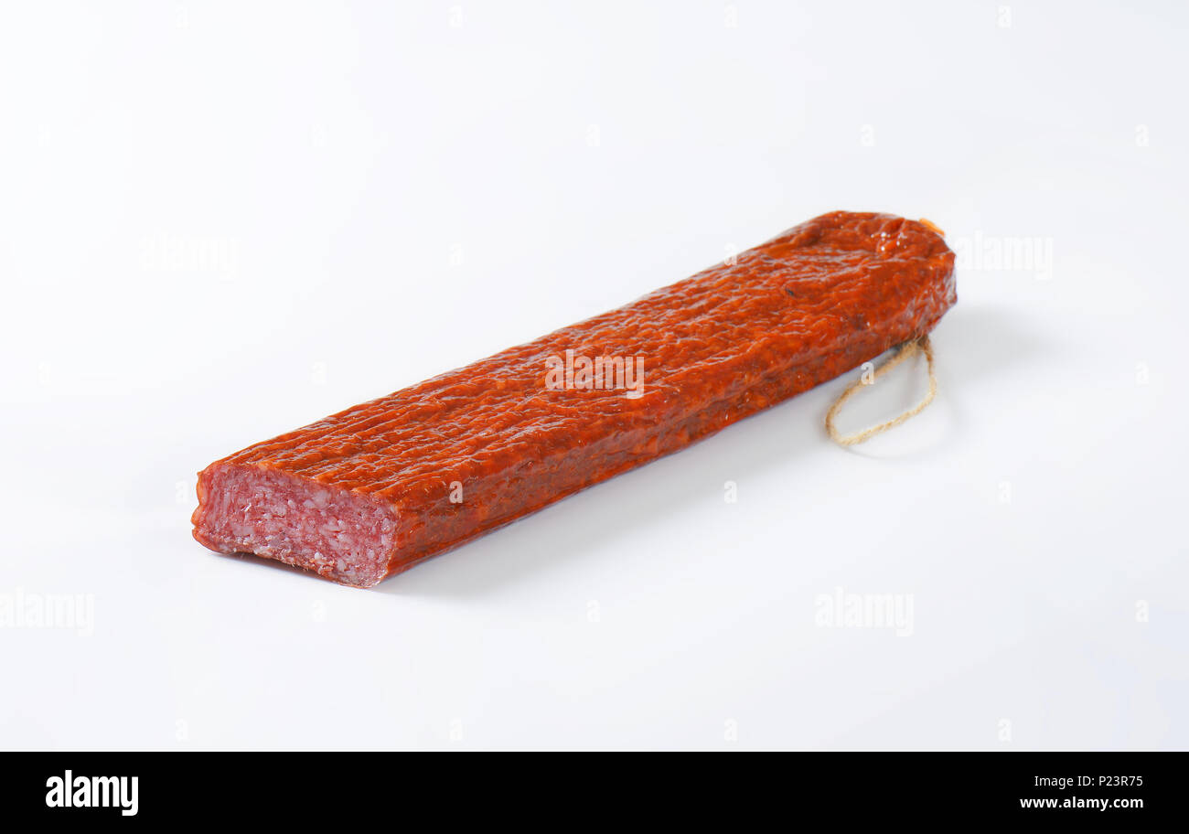 air dried salami on white background Stock Photo Alamy