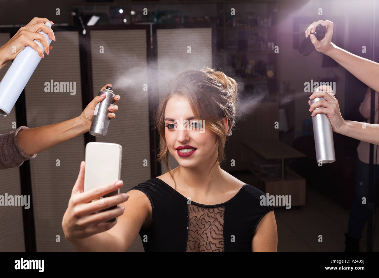 model having fixation by hair sprays and taking photo Stock Photo Alamy