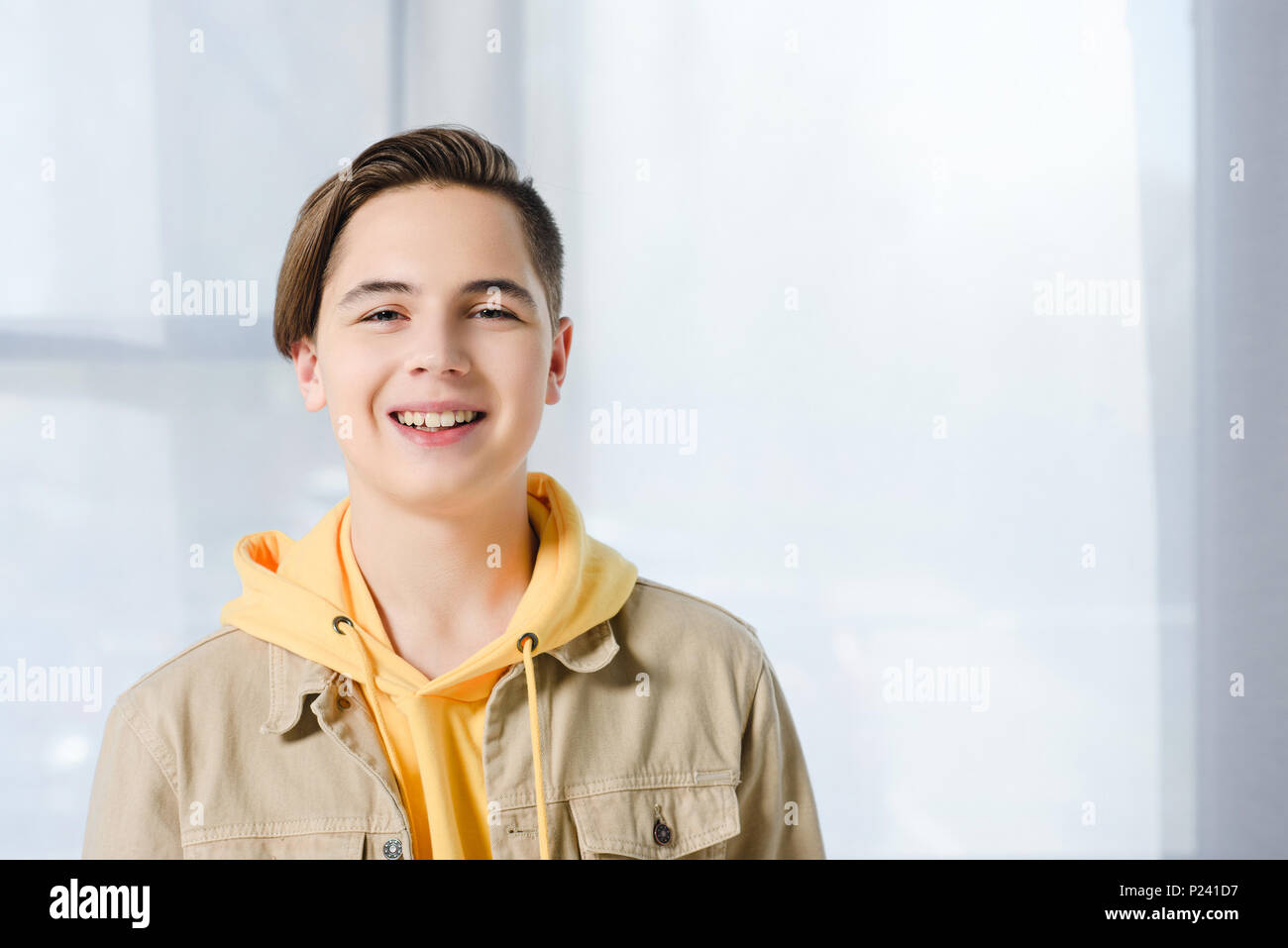 Smiling teen boy hi-res stock photography and images - Alamy