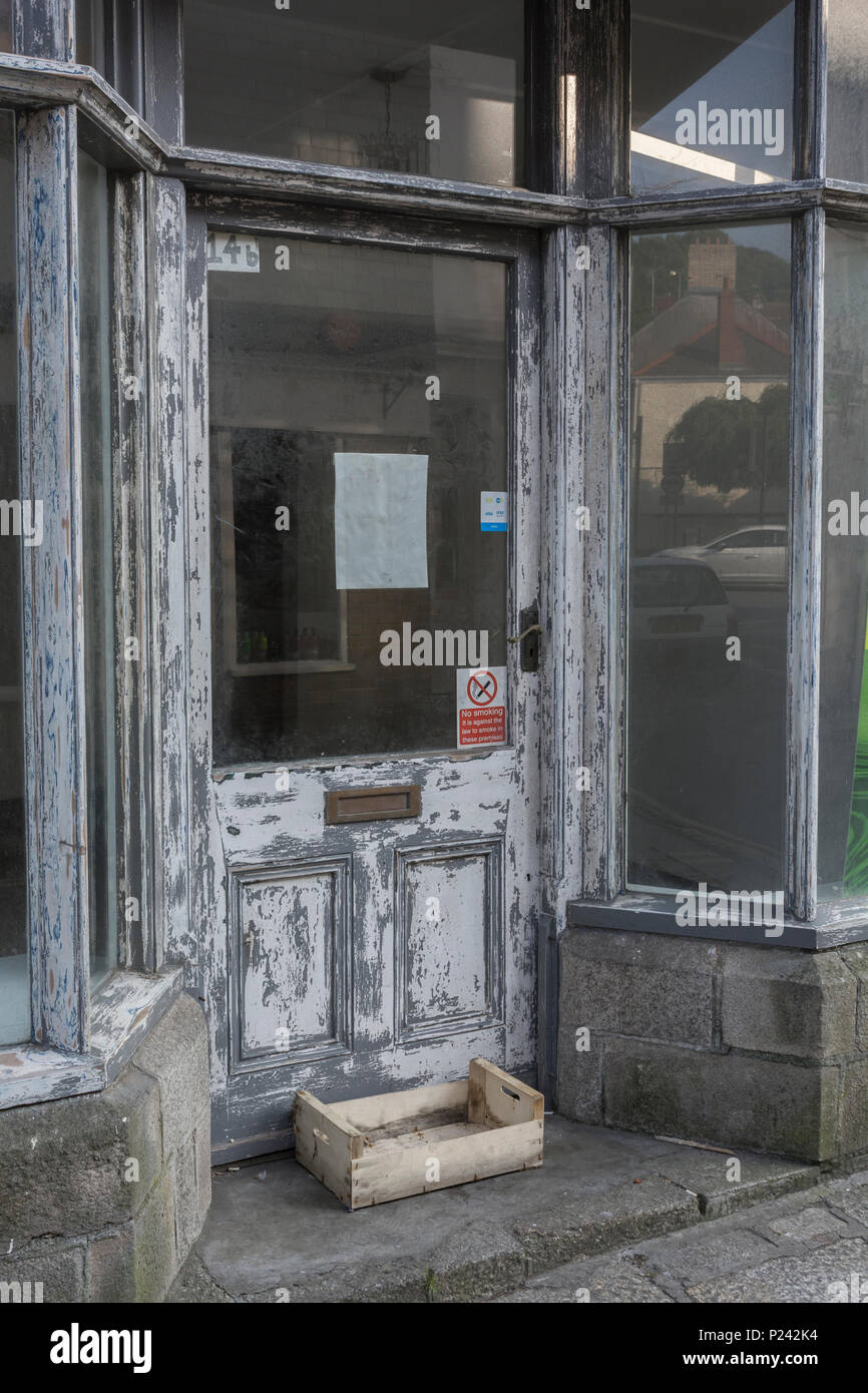 Empty vacant shop front in Truro. Metaphor Death of the High Street, closed down shops, recession, high street closures, vacant shops, unoccupied shop Stock Photo