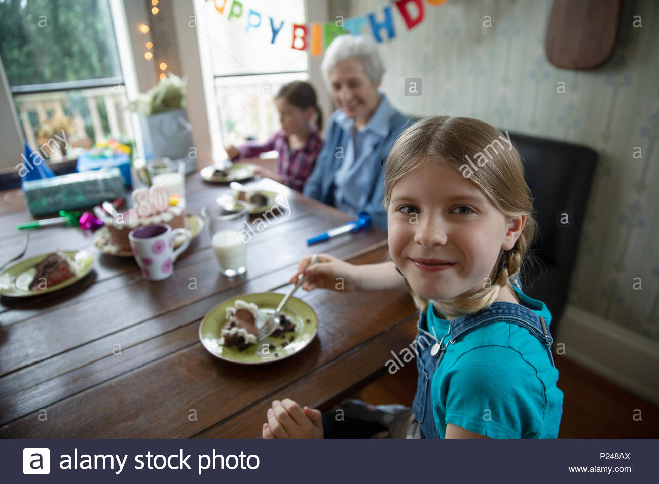 Portrait smiling granddaughter celebrating grandmother Stock Photo