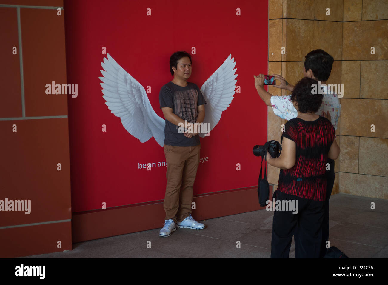 Singapore, Singapore, tourists photographed in front of angel wings Stock Photo