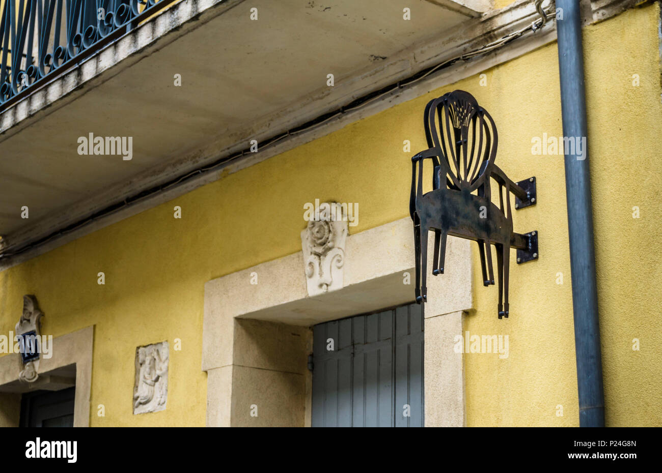 Advertising sign on a upholstery in Narbonne Stock Photo