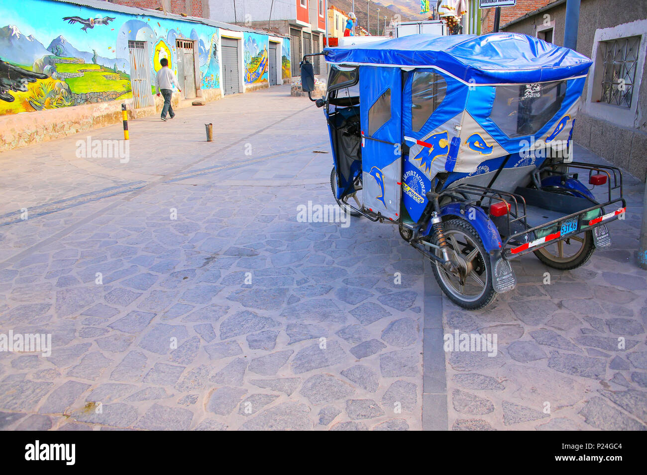 Auto rickshaw parked in the street of Chivay town, Peru. Chivay town is ...