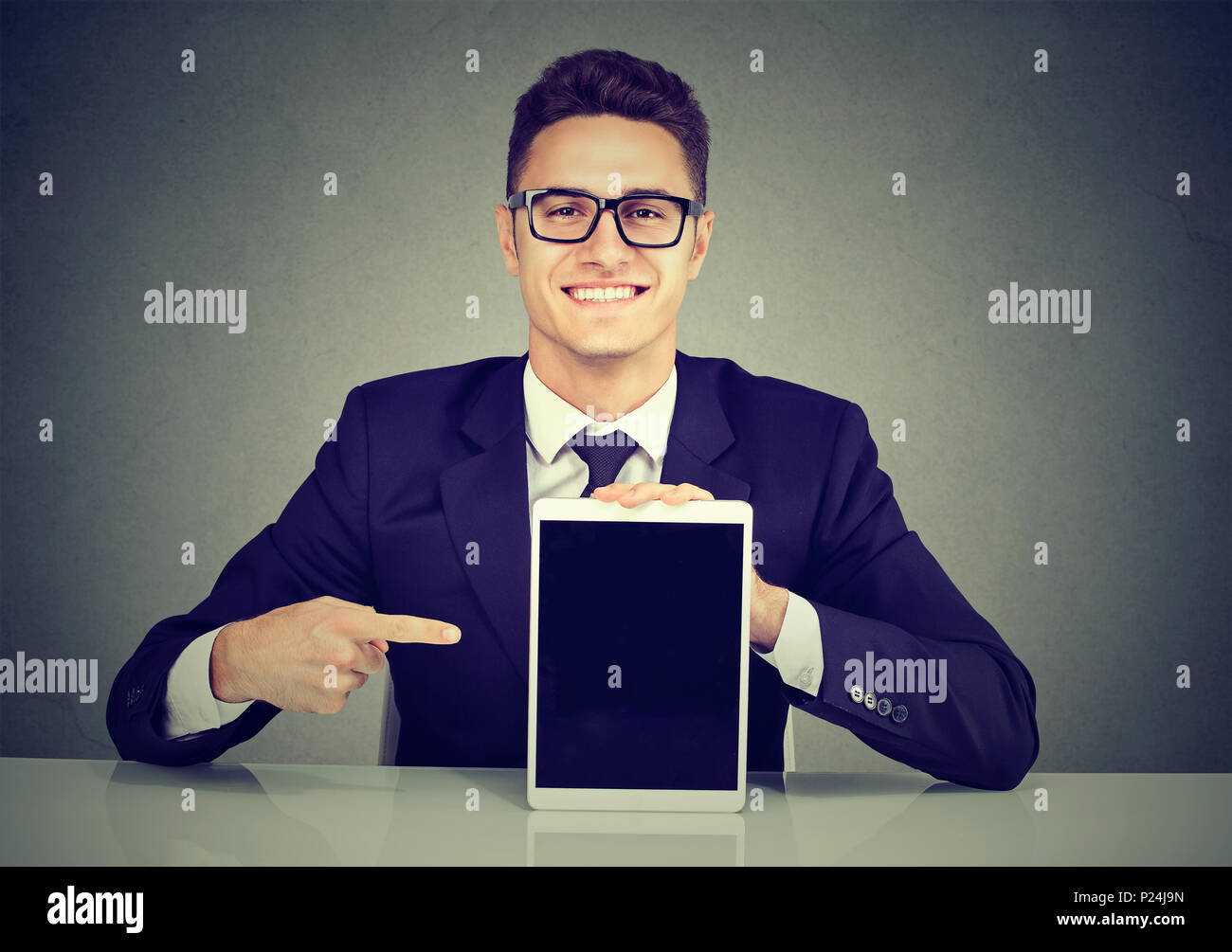 young business man showing a tablet Stock Photo