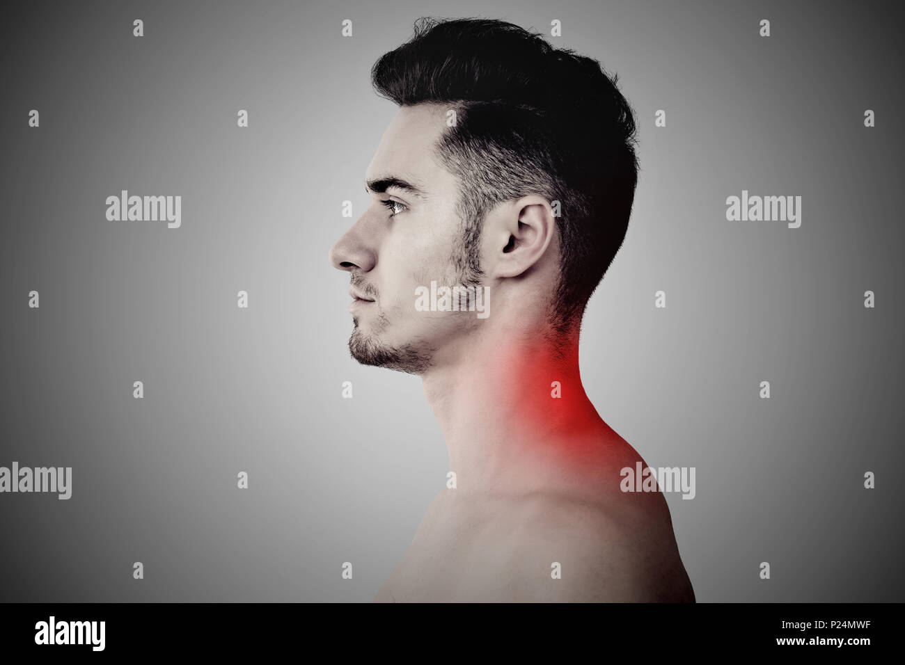 Young man with upper back neck pain Stock Photo