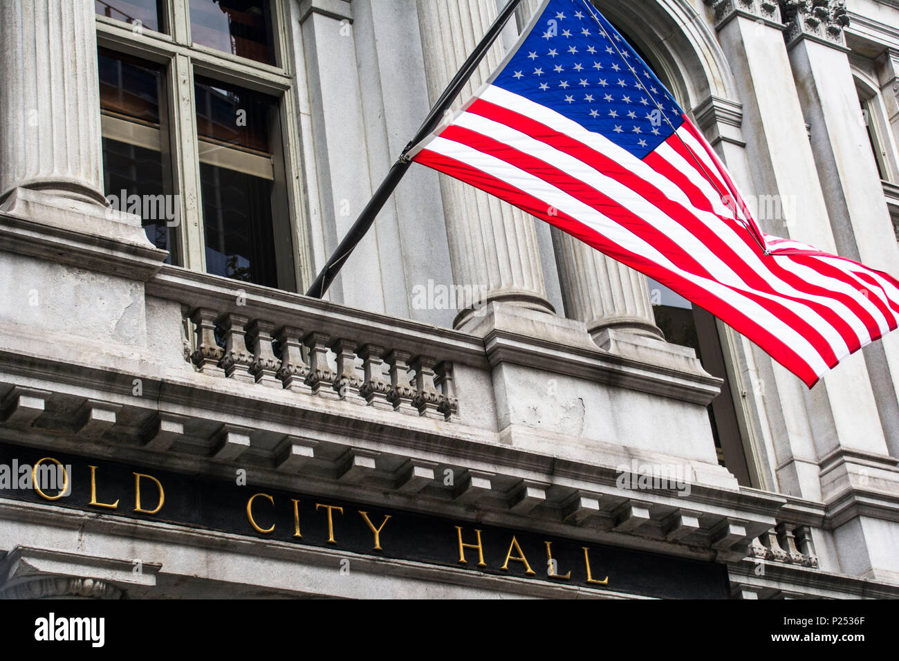 US flag in front of the 'Old City Hall' of Boston in the USA Stock