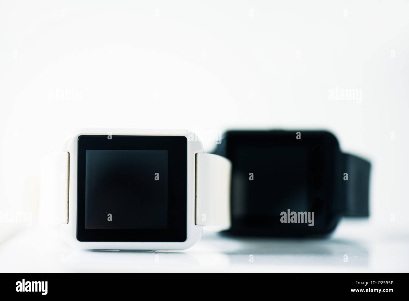close-up view of smartwatches with black screens on grey Stock Photo