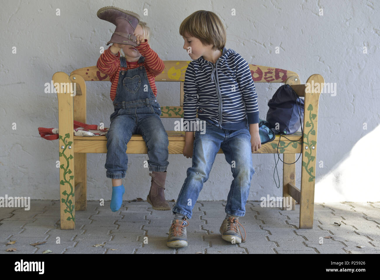 Wooden Bench Children Sitting Putting On Shoes Stock Photo