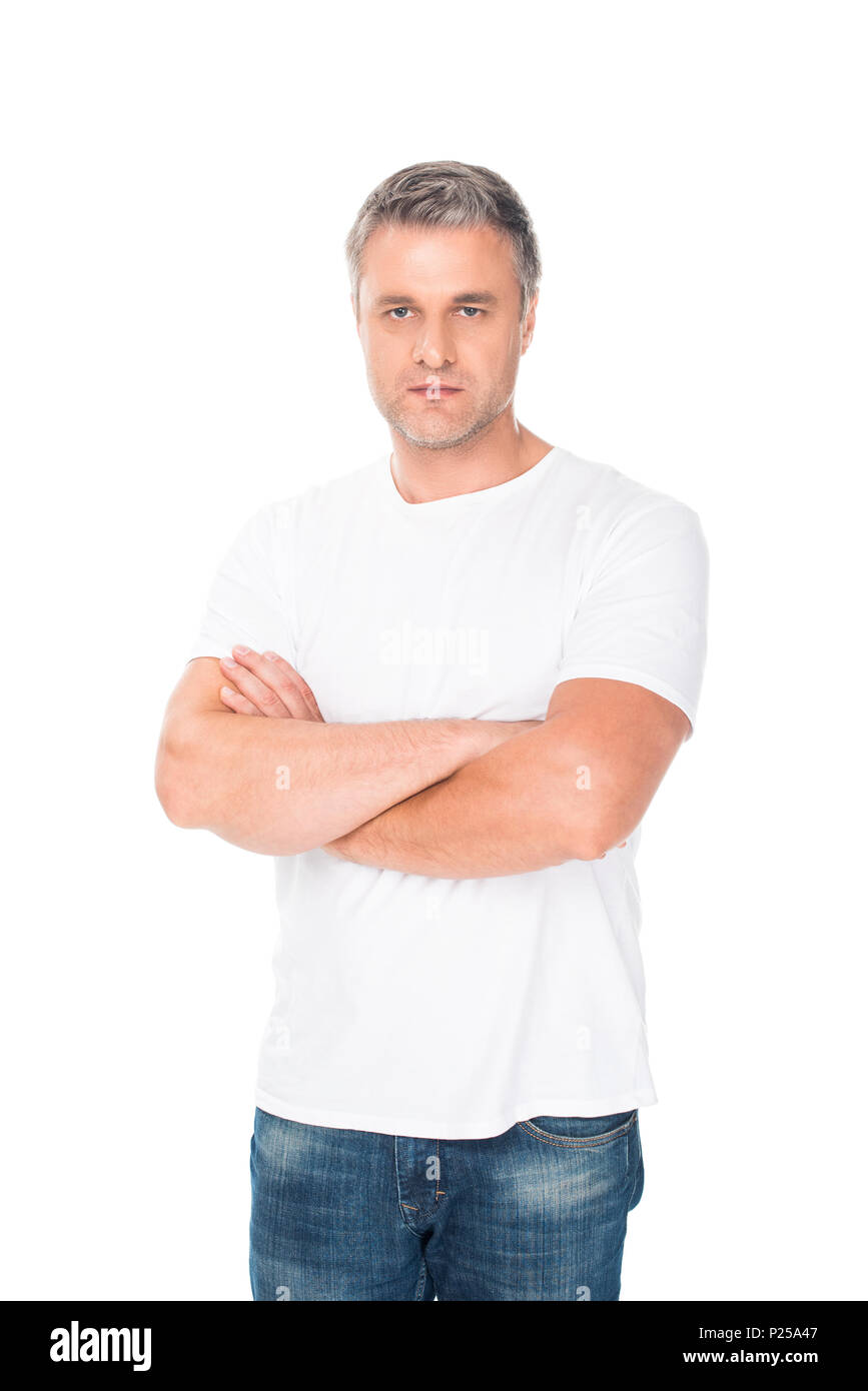 serious man with crossed arms looking at camera, isolated on white ...