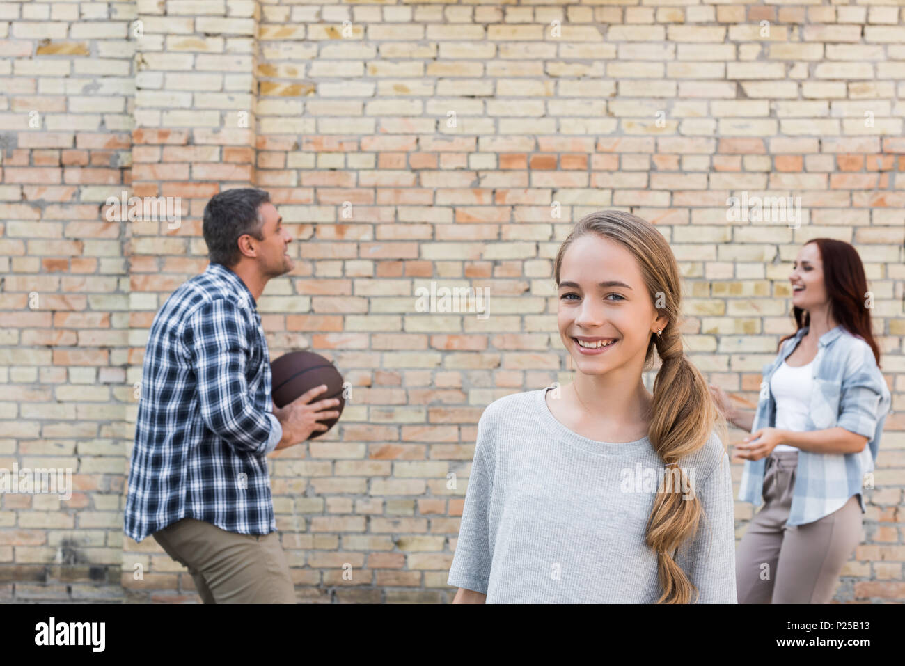 happy family playing basketball together on playground Stock Photo - Alamy