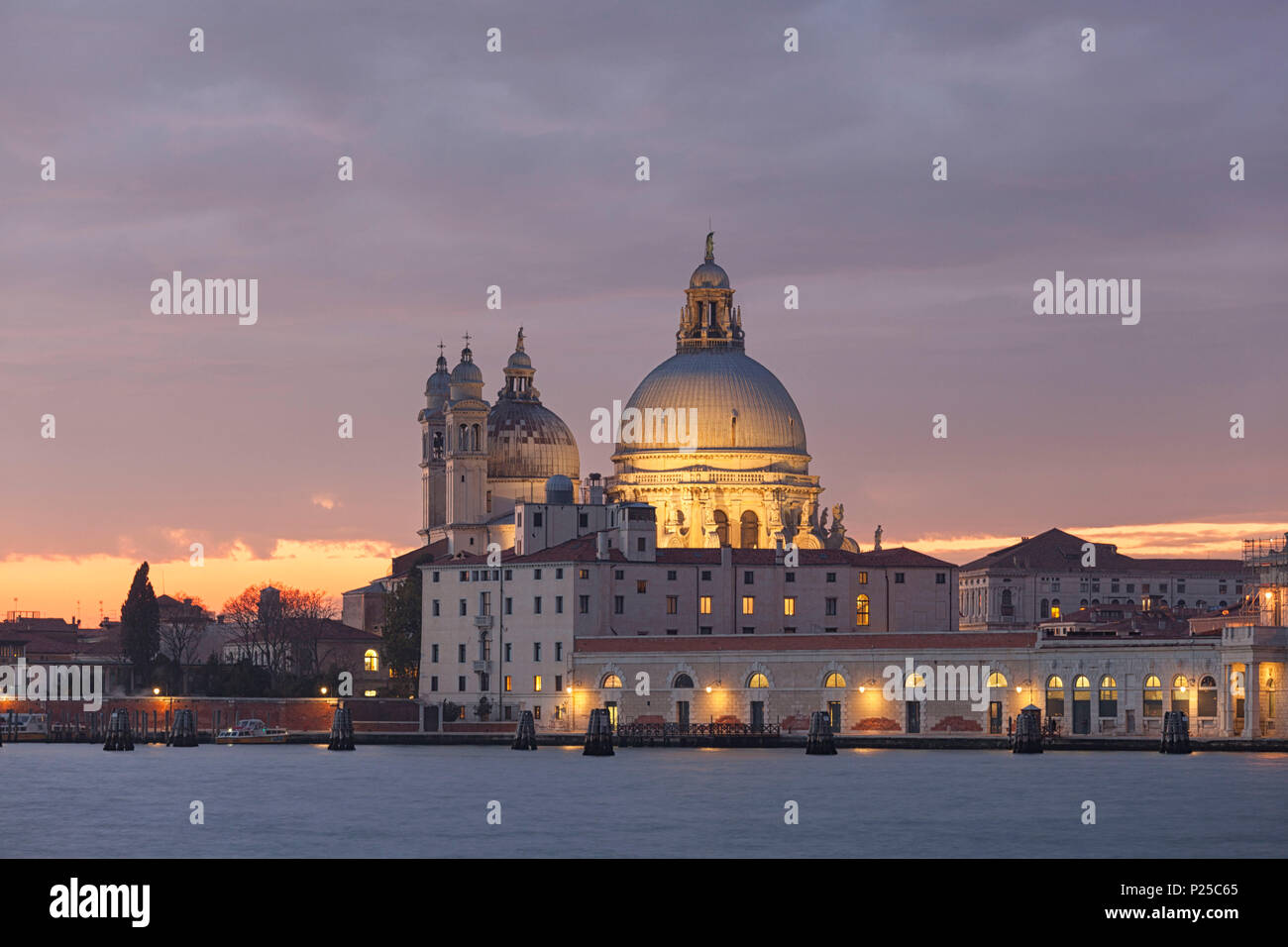 View of church of Santa Maria della Salute from San Giorgio Maggiore island at dusk, Venice, Veneto, Italy Stock Photo