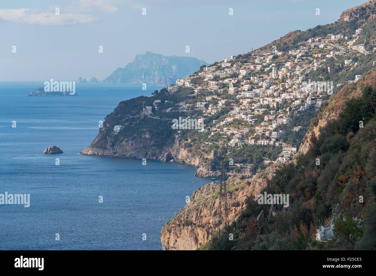 The white buildings of Praiano with Capri in the background, Conca dei Marini, Salerno province, Campania, Italy, Europe Stock Photo