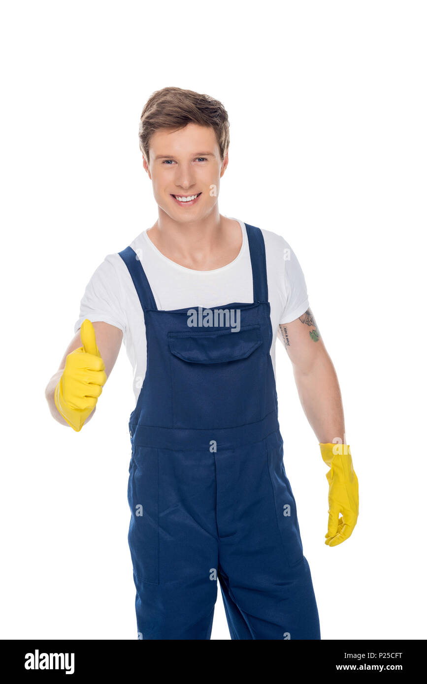 portrait of cheerful cleaner looking at camera while showing thumb up ...