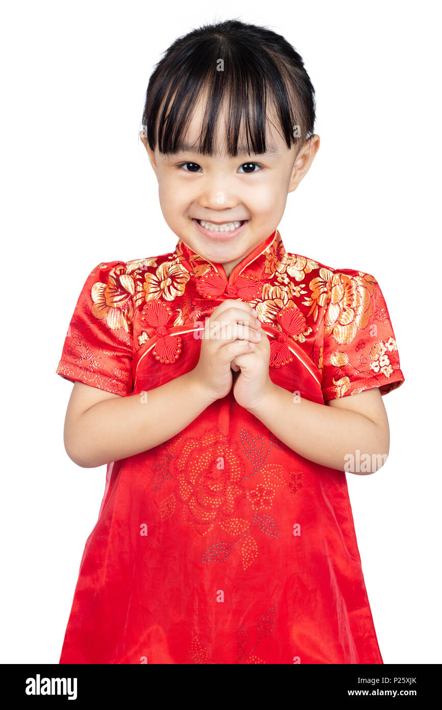 Asian Chinese little girl wearing cheongsam with greeting gesture  celebrating for Chinese New Year in isolated white background Stock Photo -  Alamy