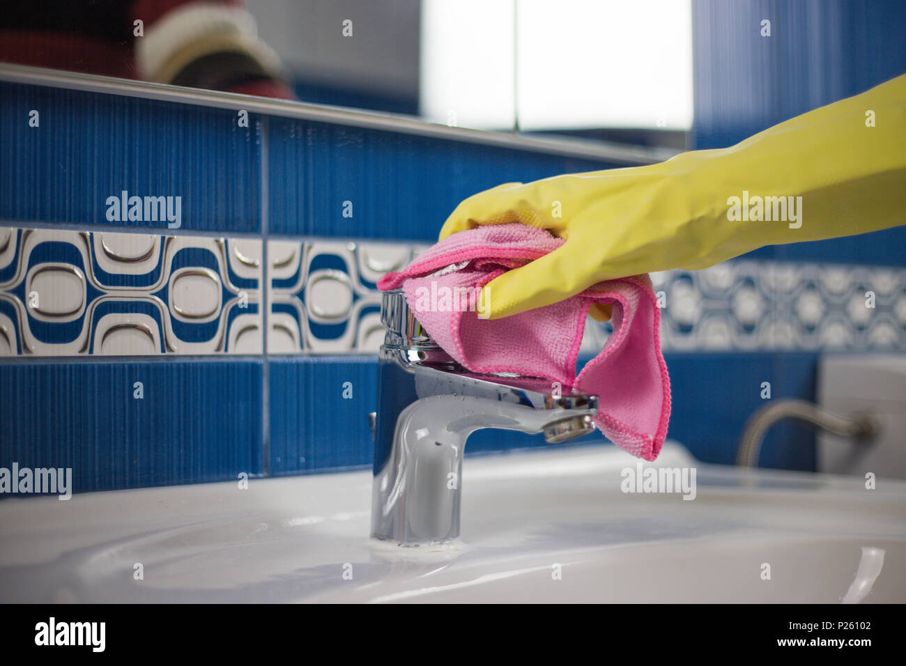 Housewife work, a housewife doing her job, cleaning her bathroom in the ...