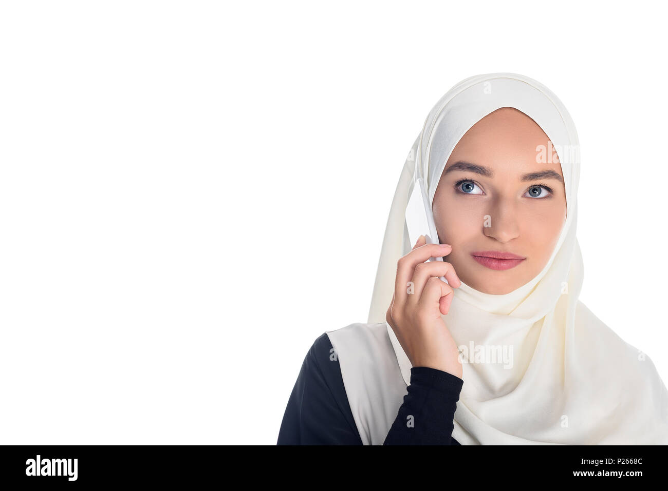 beautiful young muslim woman talking by phone isolated on white Stock ...