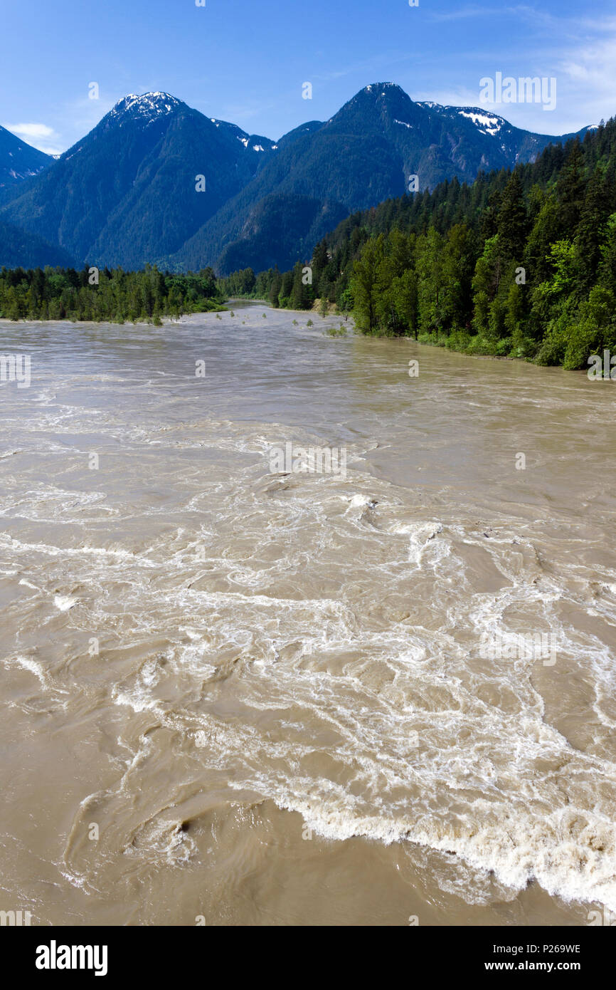 Rapids in the springtime flowing water of the Fraser River in Hope, British Columbia, Canada. Stock Photo