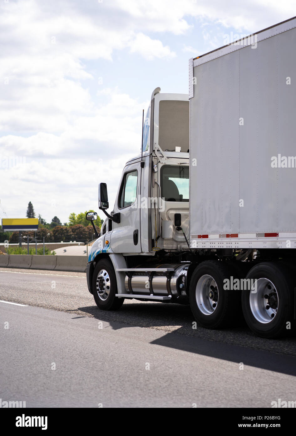 Commercial big rig white day cab local haul semi truck with roof