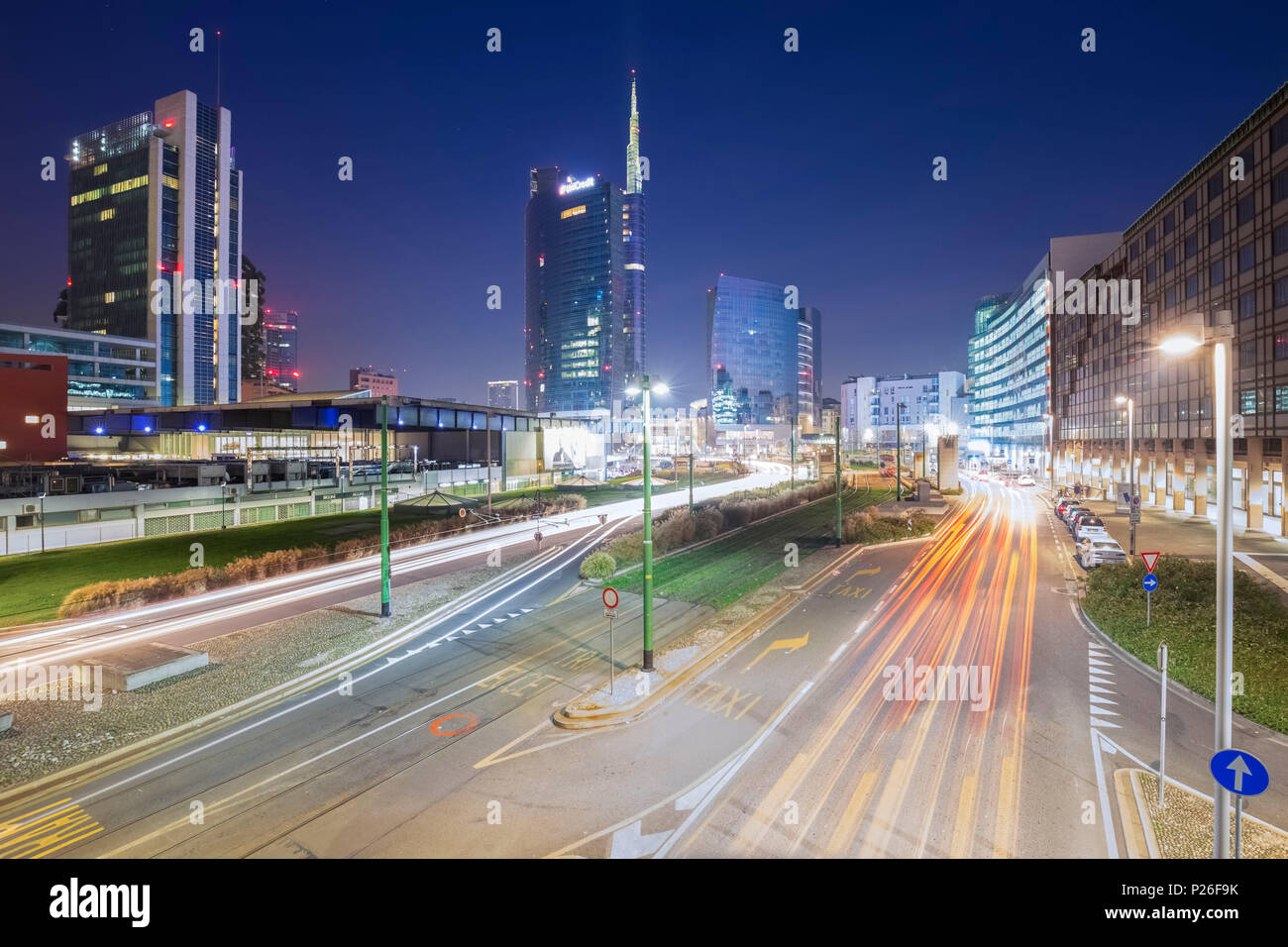 View of the Unicredit Tower and cars trails from the avenue Luigi Sturzo during the evening. Milan, Lombardy, Italy. Stock Photo