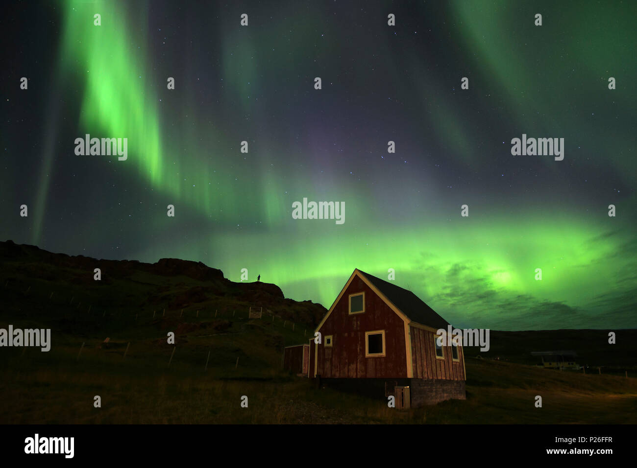 Nordic little red house with northern Lights, Qassiarsuq, Greenland Stock Photo