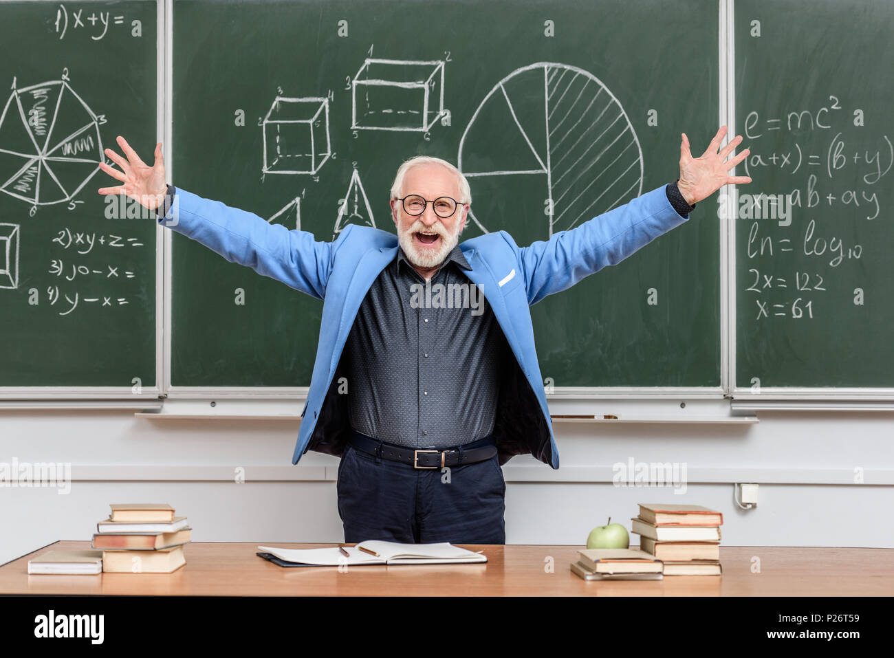 happy senior lecturer with open arms standing near blackboard Stock Photo -  Alamy