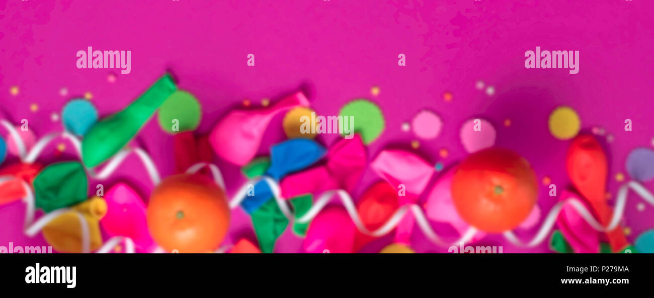 Banner defocusing festive poster balloons orange Confetti carnival background ultraviolet. Flat lay top view Stock Photo