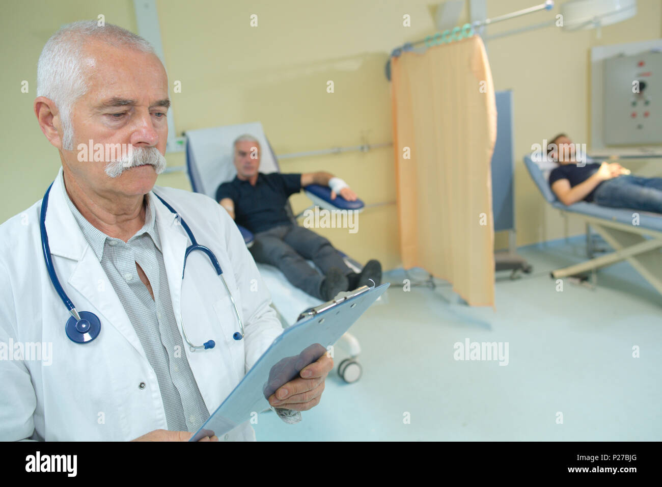 senior doctor with clipboard Stock Photo