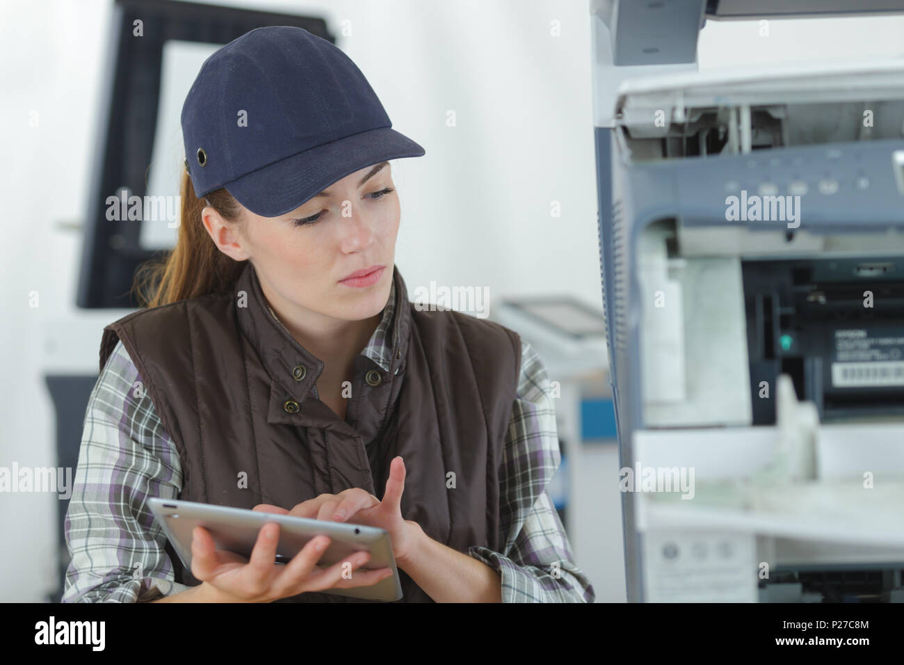 female technician using tablet computer Stock Photo