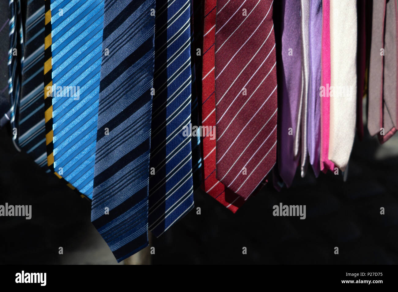 different colors silk tie on display stand Stock Photo Alamy