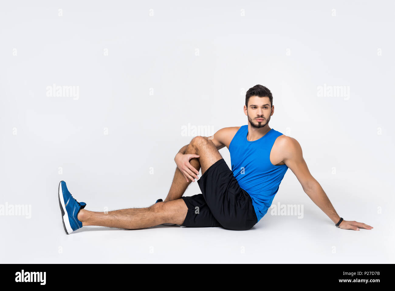 Man stretching leg on floor hi res stock photography and images Alamy