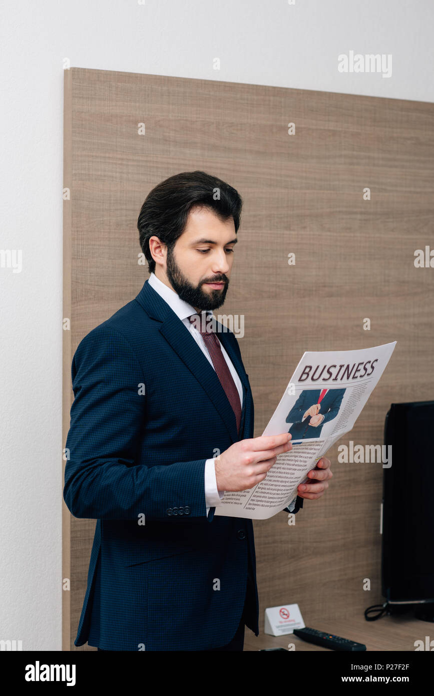 bearded businessman reading newspaper at hotel room Stock Photo - Alamy