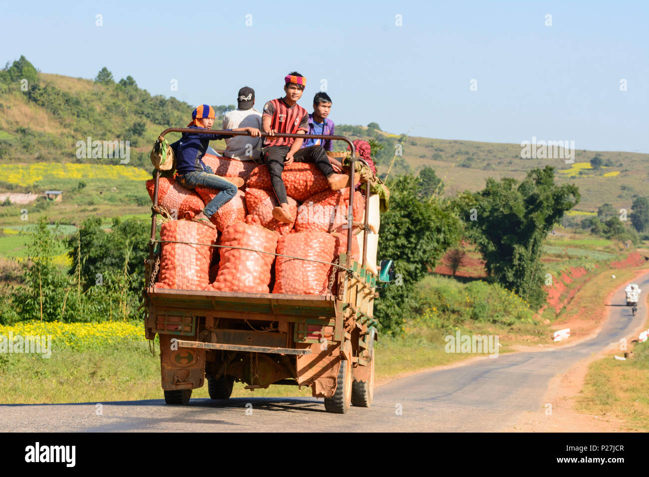 Kalaw, rural road, truck, bags with oranges, Shan State, Myanmar (Burma) Stock Photo