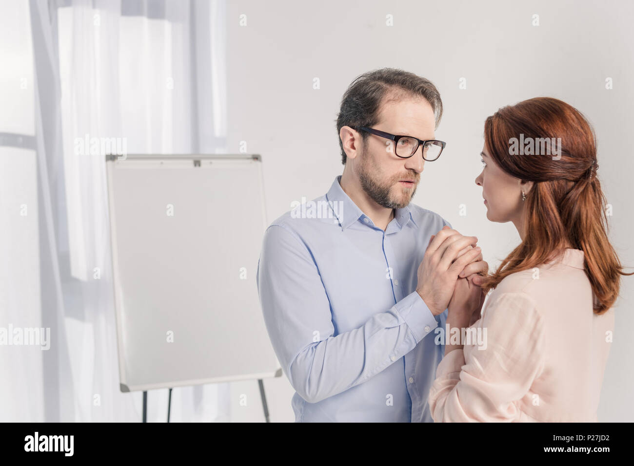 Middle aged woman holding sign hi-res stock photography and images - Alamy
