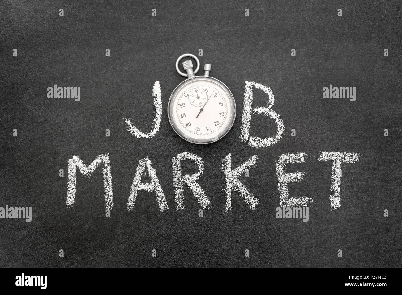 job market phrase handwritten on chalkboard with vintage precise stopwatch used instead of O Stock Photo