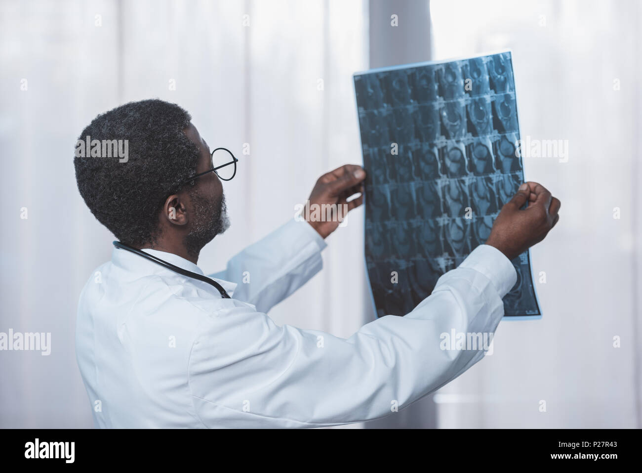 Doctor looking at an x ray hi-res stock photography and images - Alamy