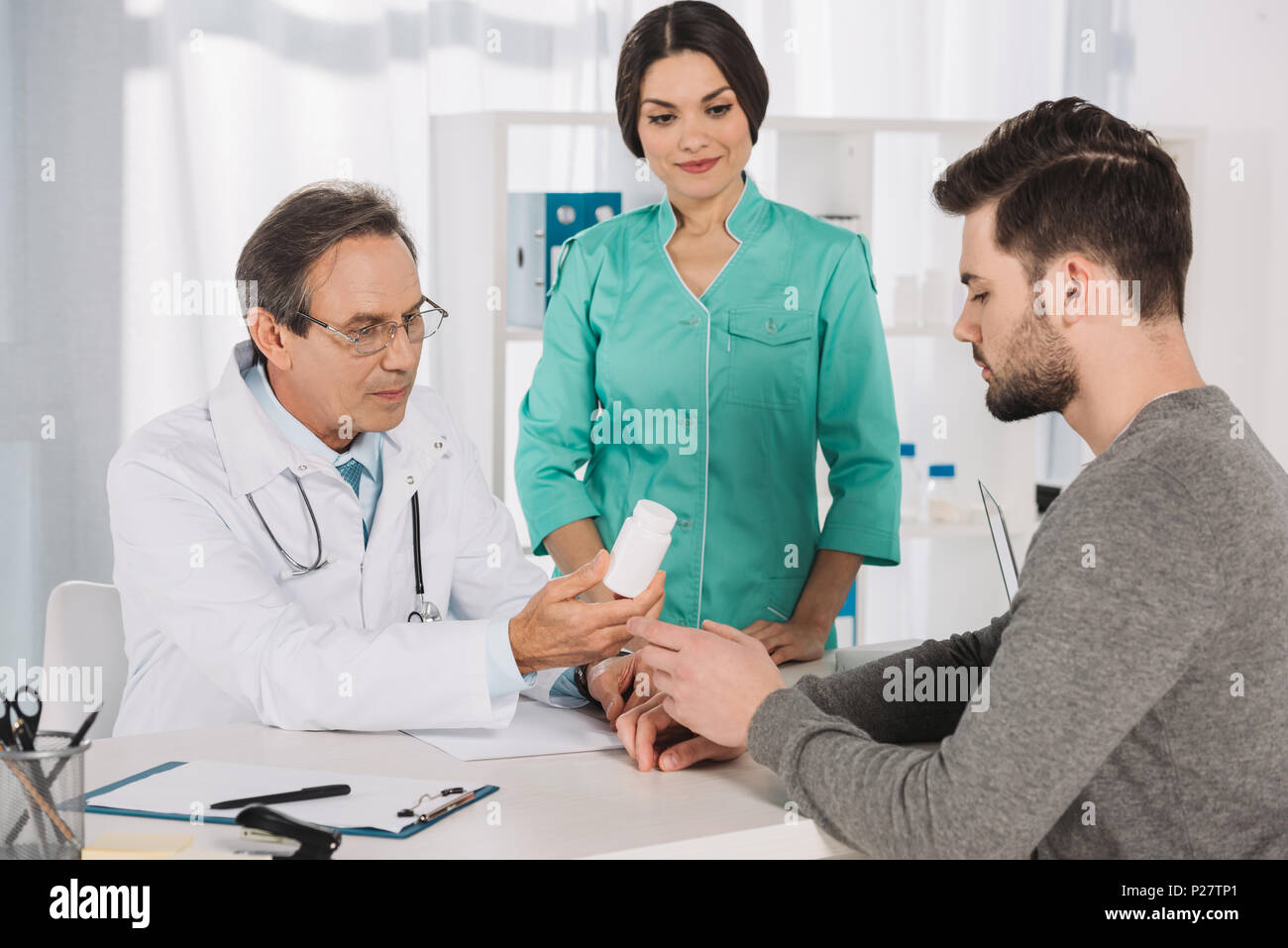 Beautiful mature doctor giving hi-res stock photography and images - Alamy