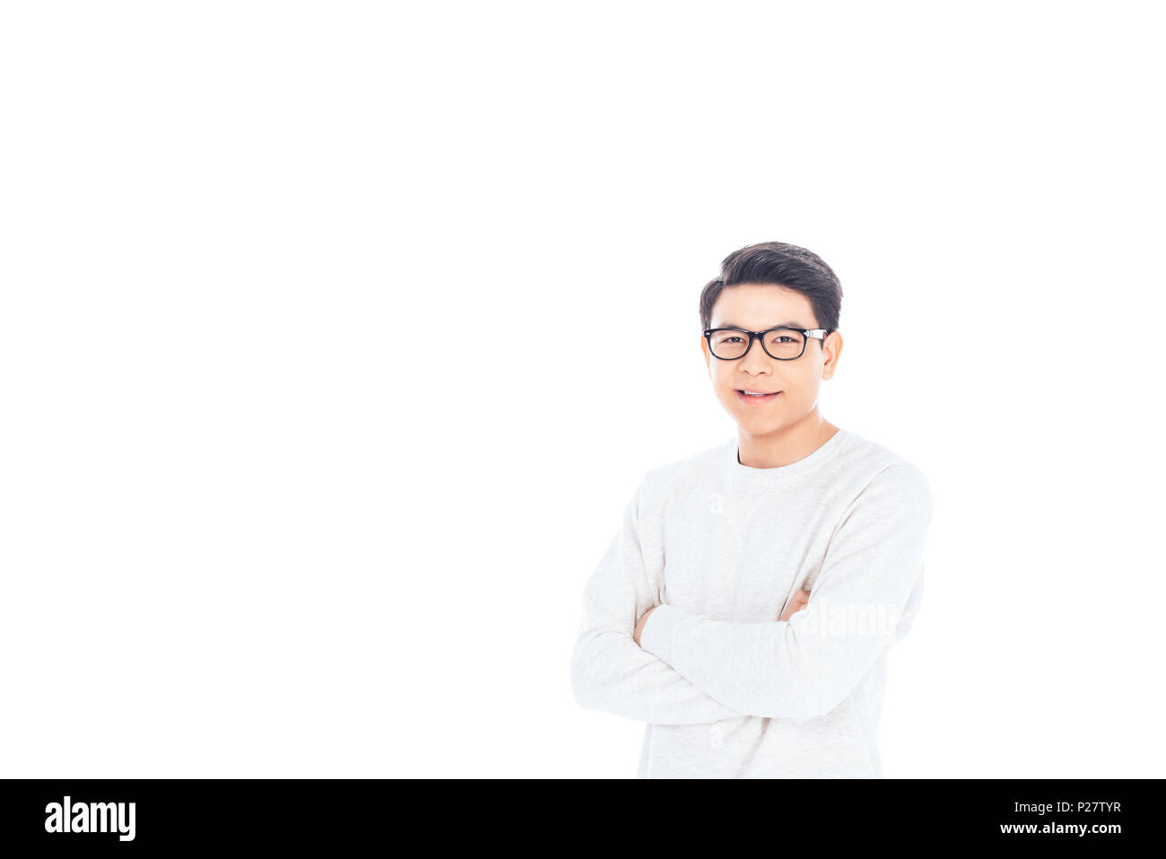 portrait of asian teenager in eyeglasses with arms crossed isolated on white Stock Photo