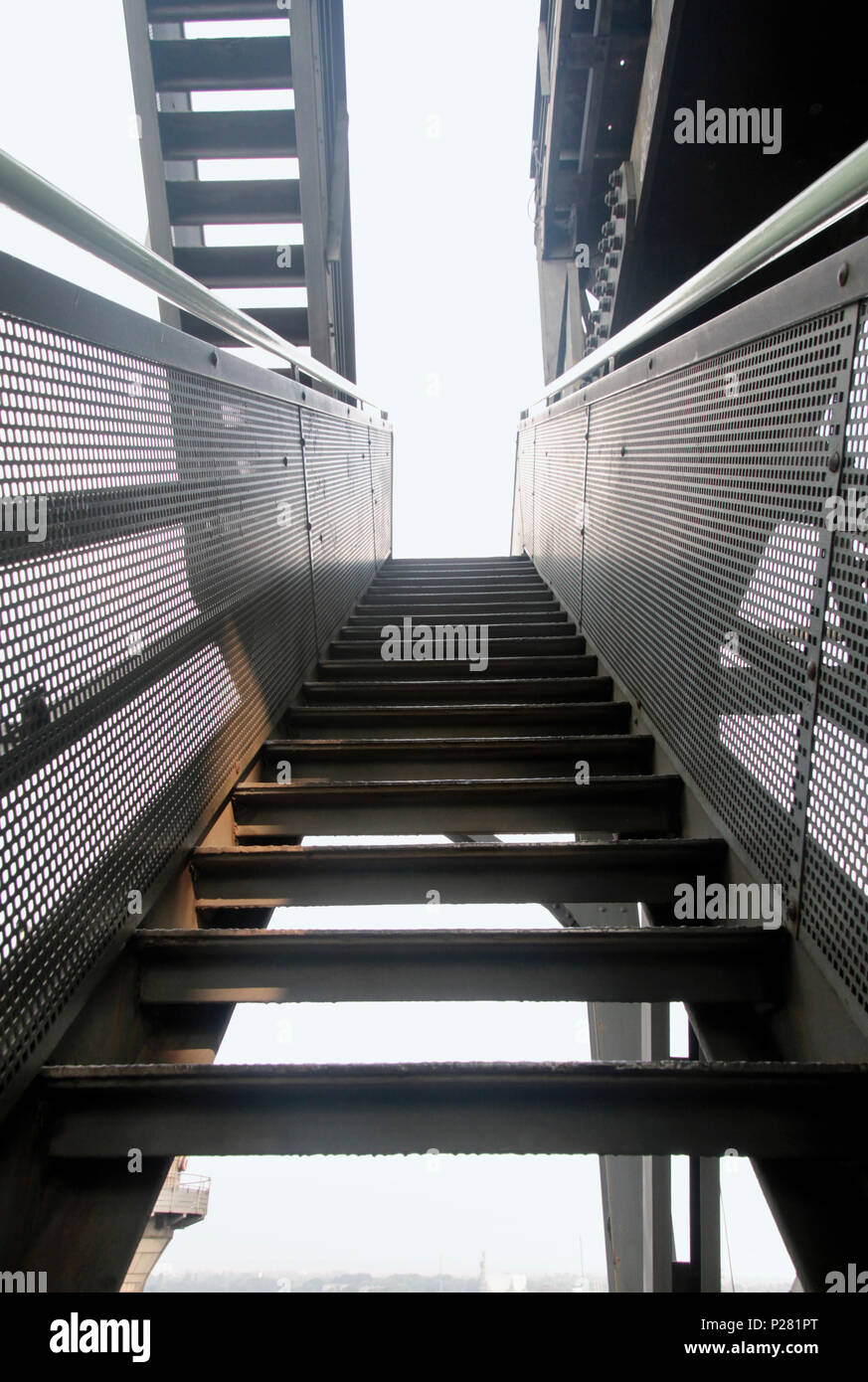 Metal stairs going upwards in abandoned factory Stock Photo - Alamy