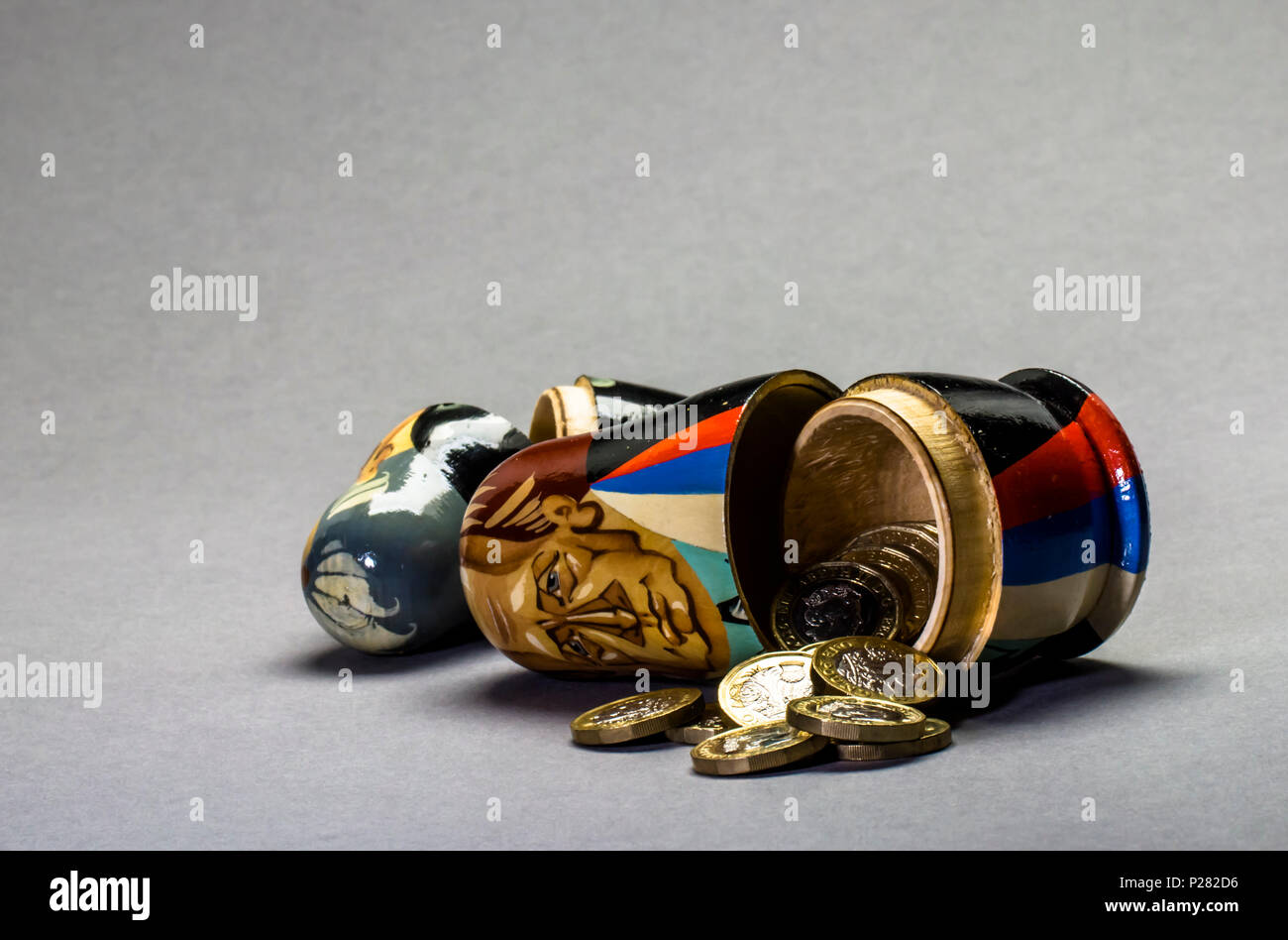 Political and financial concept pictures Modern A matryoshka doll (russian doll) with money inside Stock Photo