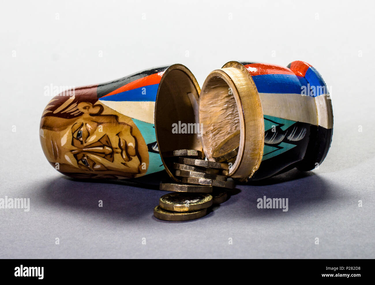 Political and financial concept pictures Modern A matryoshka doll (russian doll) with money inside Stock Photo